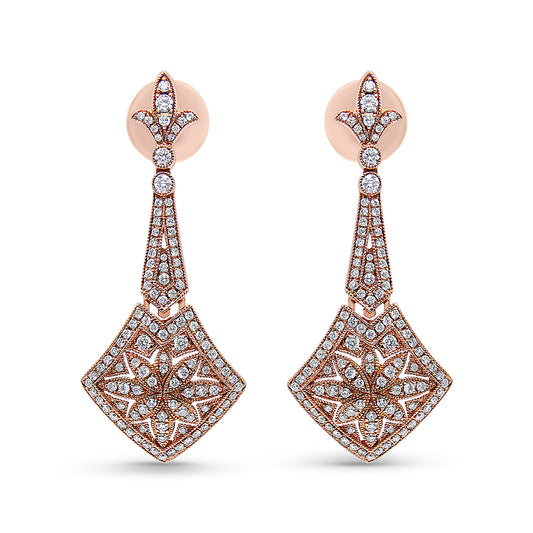 Front-facing shot of a pair of rose metal drop earrings with white round gemstones in prong settings arranged in intricate floral and geometric patterns.