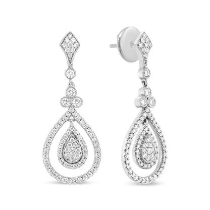 Front and side view of white metal drop earrings with teardrop-shaped design featuring multiple clusters of small white gemstones in bezel and prong settings.