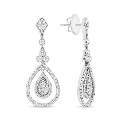 Front and side view of white metal drop earrings with multiple round white gemstones in bezel and prong settings arranged in a teardrop shape.