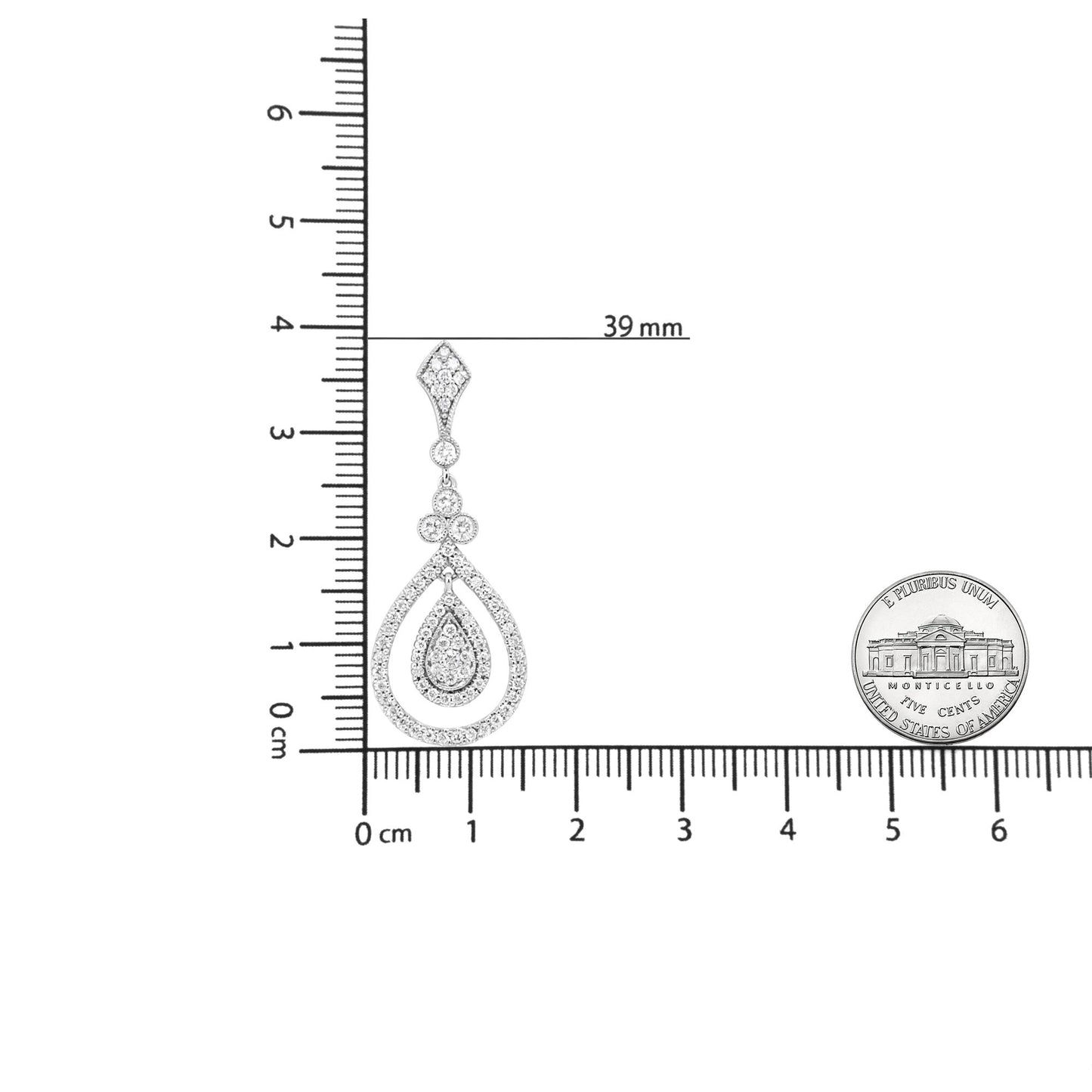 White metal drop earring with teardrop shape, featuring multiple round white gemstones in bezel and prong settings, shown on a scale from a front angle.