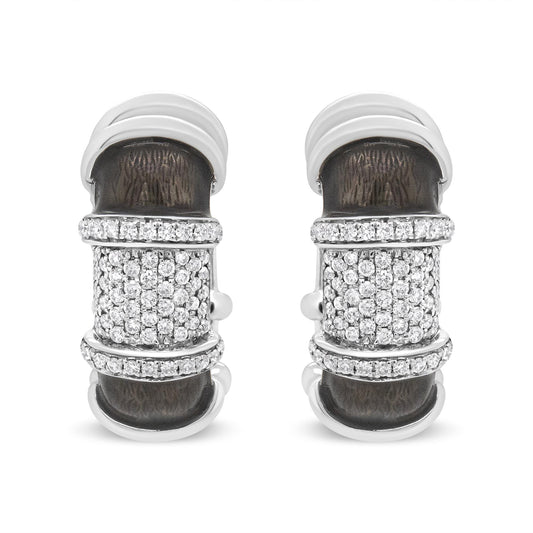 Pair of white metal earrings with textured dark central panels and multiple rows of round white gemstones, shown from the front angle on a white background.