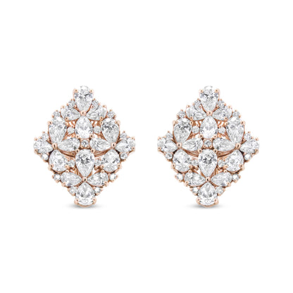 Front view of a pair of rose metal earrings featuring pear and round shaped white gemstones in prong settings arranged in a symmetrical cluster design.