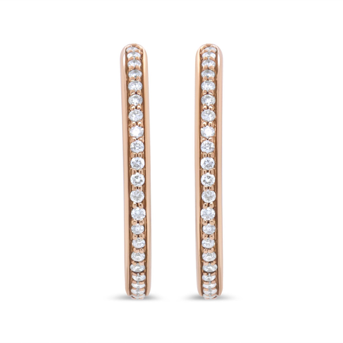 Front view of rose-colored metal hoop earrings with round white gemstones in prong settings along the outer edges.