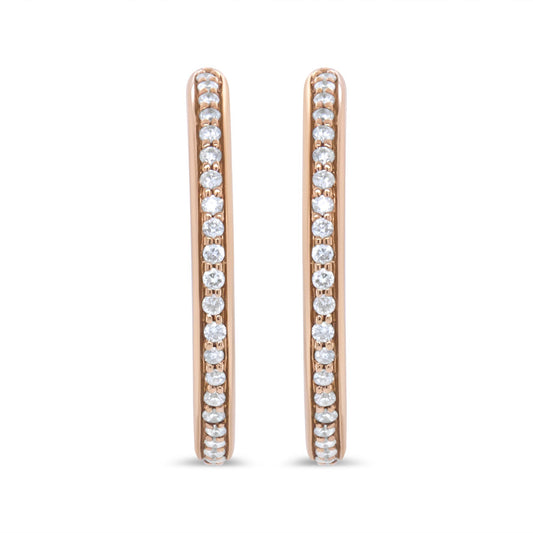 Front view of rose-colored metal hoop earrings with round white gemstones in prong settings along the outer edges.