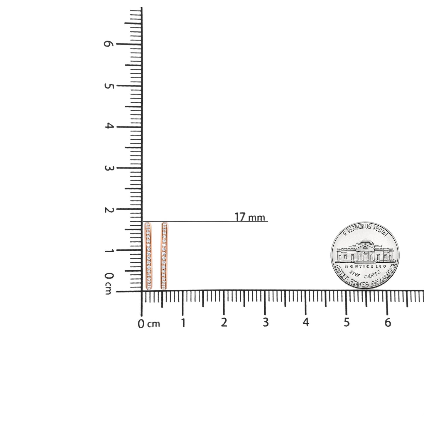Pair of rose-colored bar earrings with a row of round white gemstones, shown flat on a ruler and scale for size reference, top-down angle.