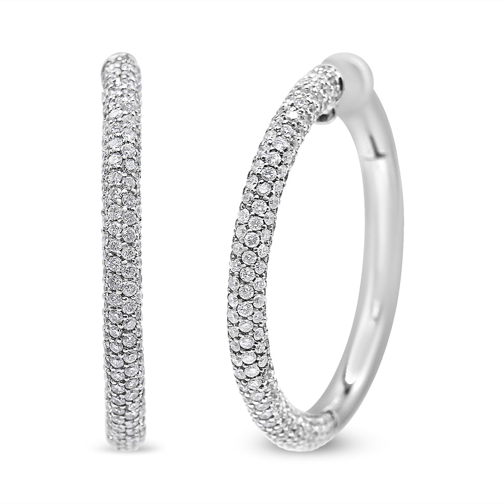 Close-up front and side view of white metal hoop earrings with round white gemstones in pave setting.