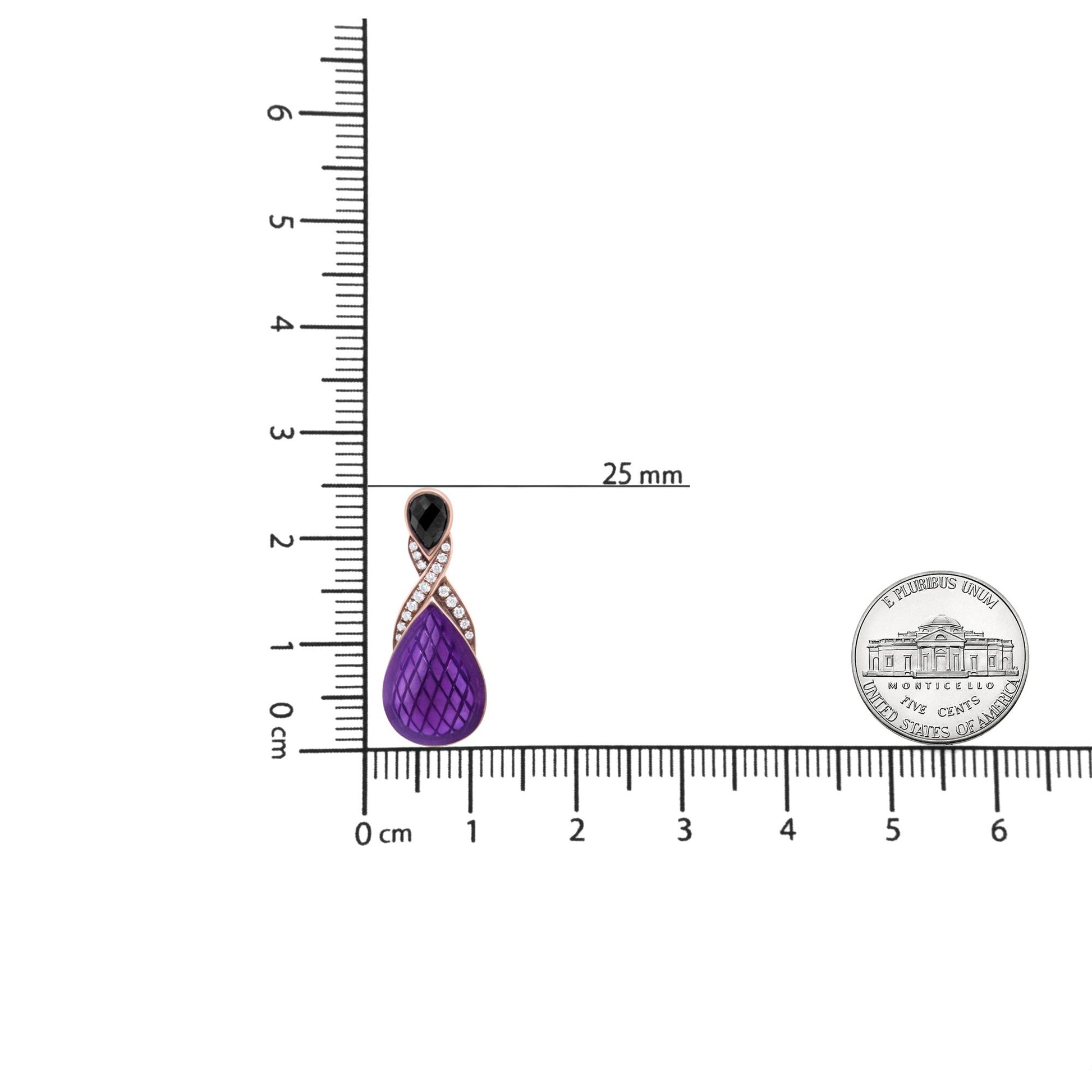 Earring with white metal, round white gemstones in a pave setting forming a twisted design, and pear-shaped black gemstones in a bezel setting at the top, photographed on a ruler for size reference from a front angle.