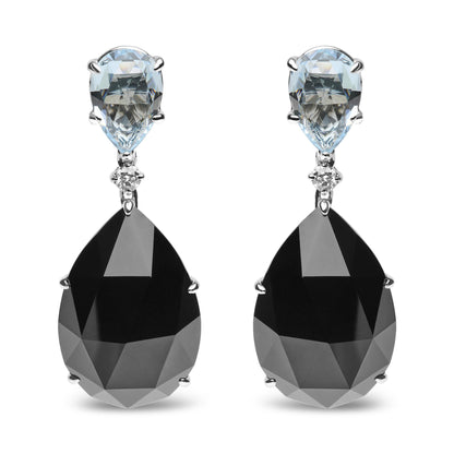 Front view of white metal drop earrings with pear-shaped blue gemstones at the top, small round white gemstones in the middle, and large pear-shaped black gemstones at the bottom.