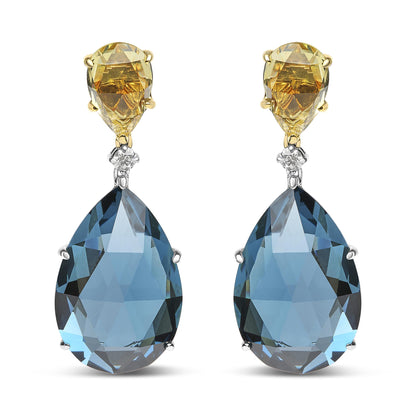 Front-facing image of drop earrings featuring yellow metal settings with lemon-colored pear-shaped gemstones at the top, a small white round gemstone in the middle, and large blue pear-shaped gemstones set in white metal at the bottom.