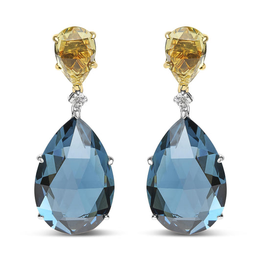 Front-facing image of drop earrings featuring yellow metal settings with lemon-colored pear-shaped gemstones at the top, a small white round gemstone in the middle, and large blue pear-shaped gemstones set in white metal at the bottom.