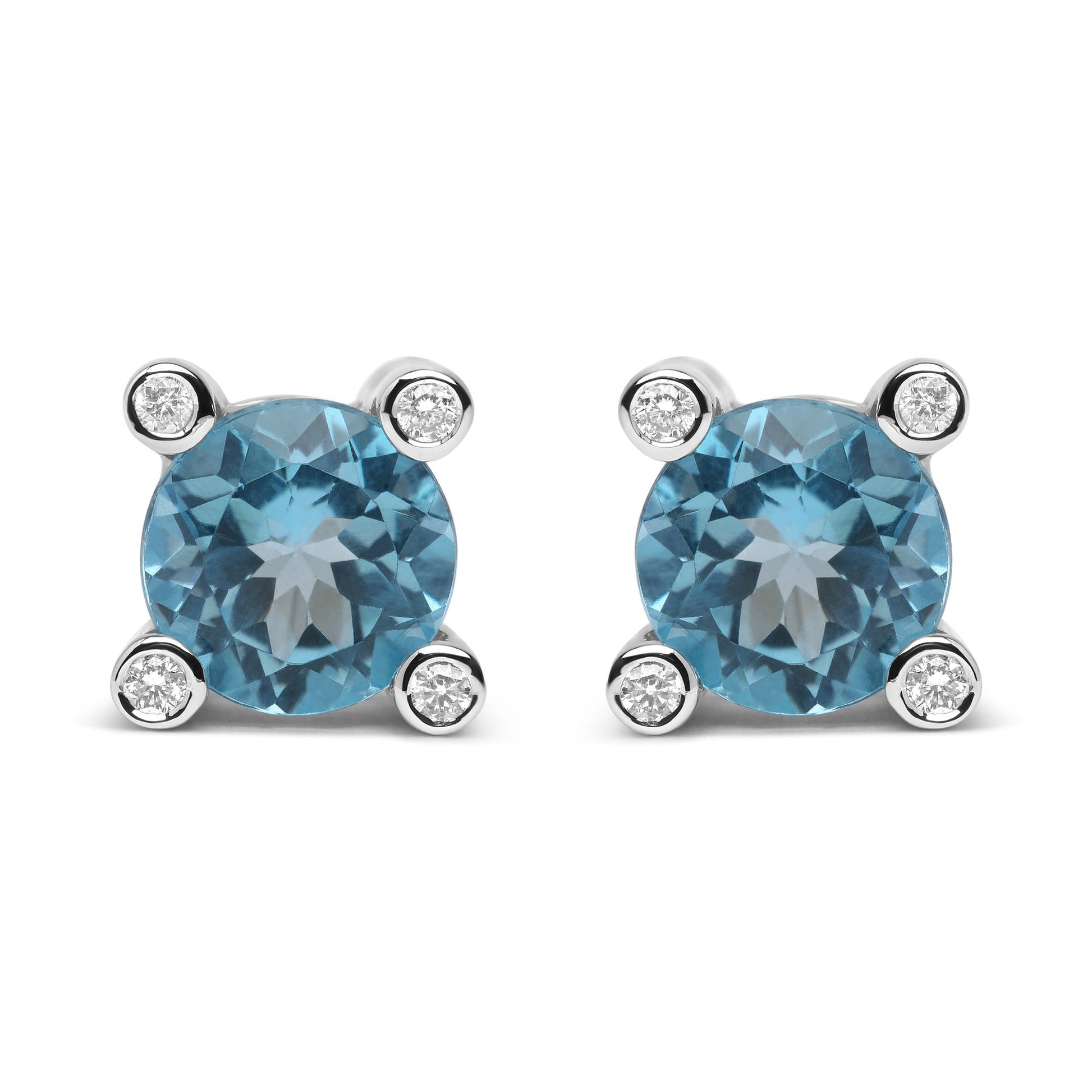 Front view of pair of white metal stud earrings with round blue gemstones prong set in the center and small round white gemstones bezel set at each corner.