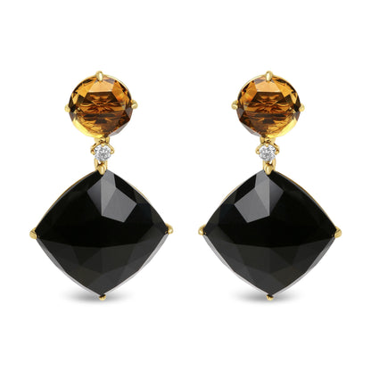 Front view of yellow metal drop earrings featuring round yellow gemstones, small round white gemstones, and large cushion-shaped black gemstones.