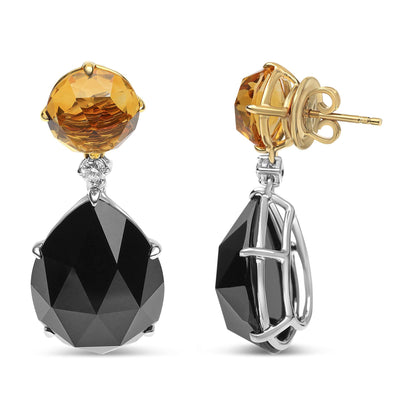 Front and side views of yellow and white metal earrings with a round yellow gemstone at the top, a small white gemstone beneath it, and a large black pear-shaped gemstone dangling below.