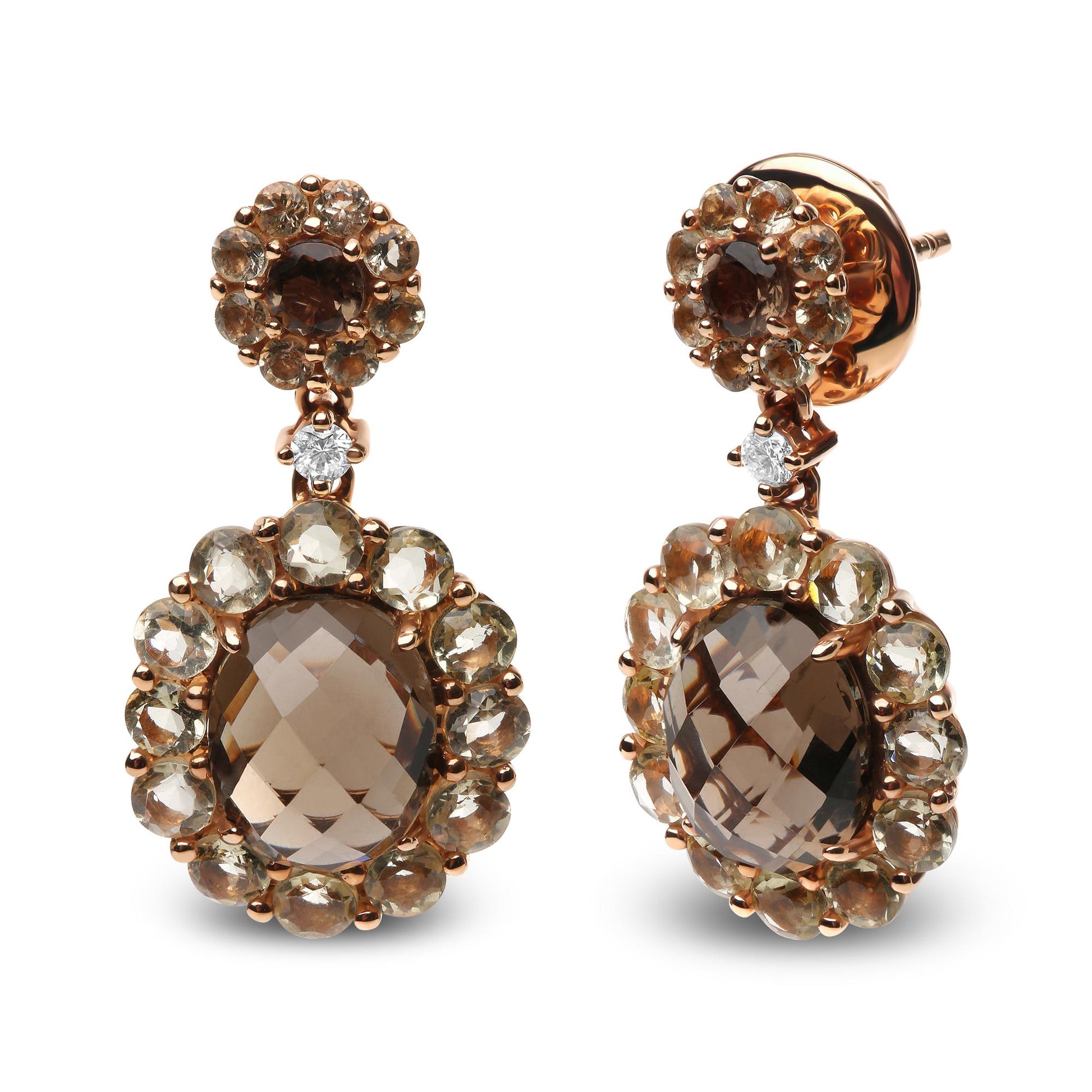 Front-facing shot of rose metal drop earrings featuring oval and round smoky gemstones surrounded by smaller round smoky and lemon-colored gemstones, each earring accented with a small white gemstone.