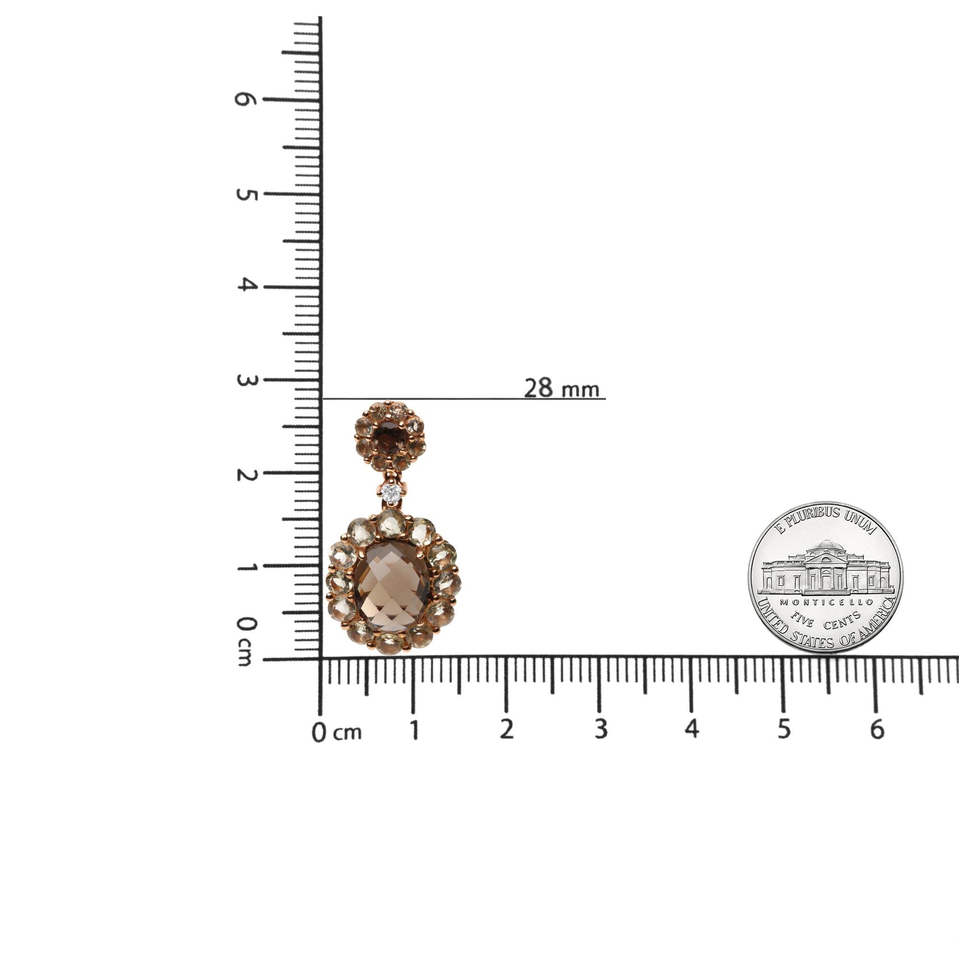 Front view of a rose-colored metal earring with a central oval smoky gemstone surrounded by round smoky and lemon-colored gemstones, featuring a round top part with a red gemstone and a white gemstone in between, displayed on a scale for size reference.