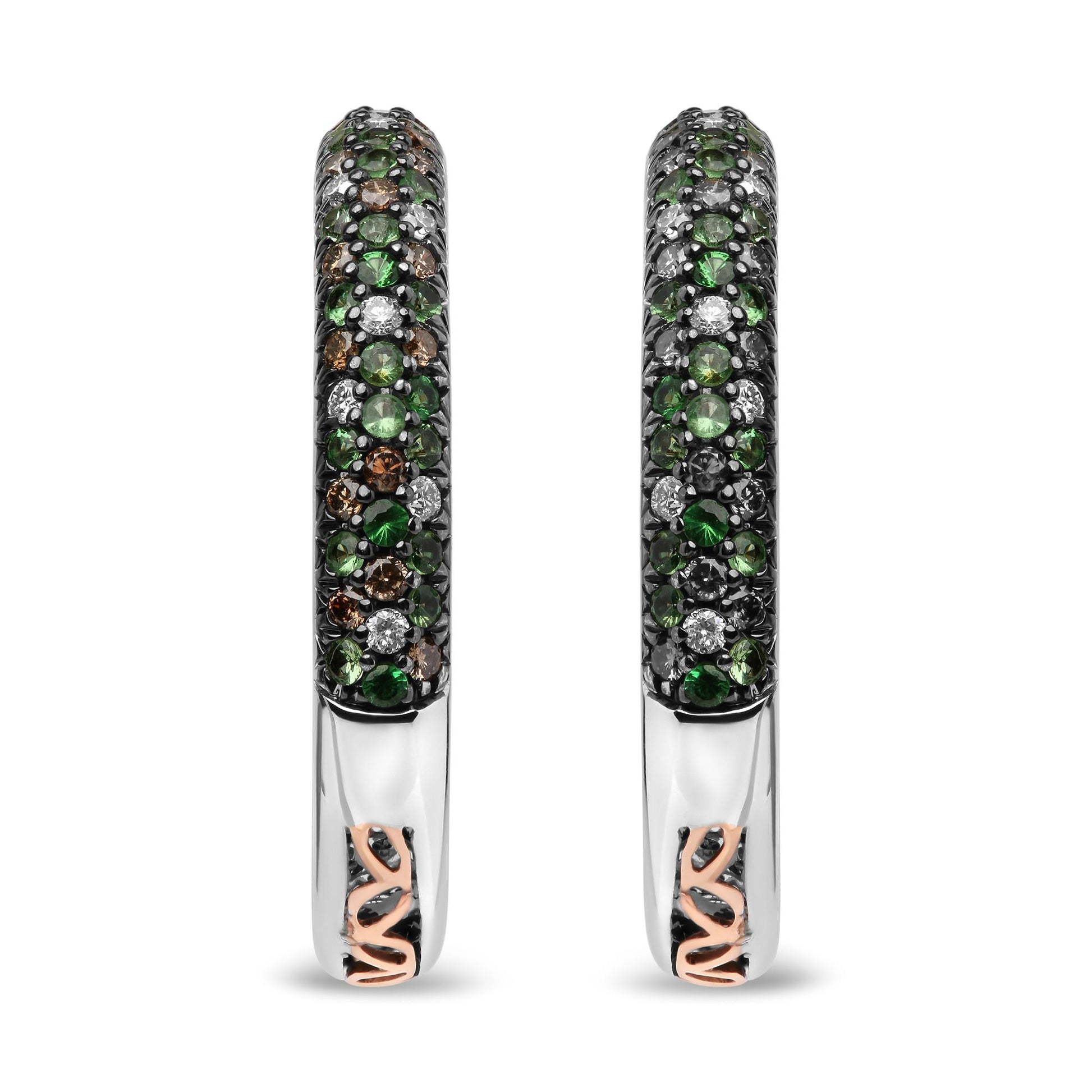 Front-facing close-up of white metal hoop earrings set with round green gemstones, round brown gemstones, and round white gemstones in prong settings.