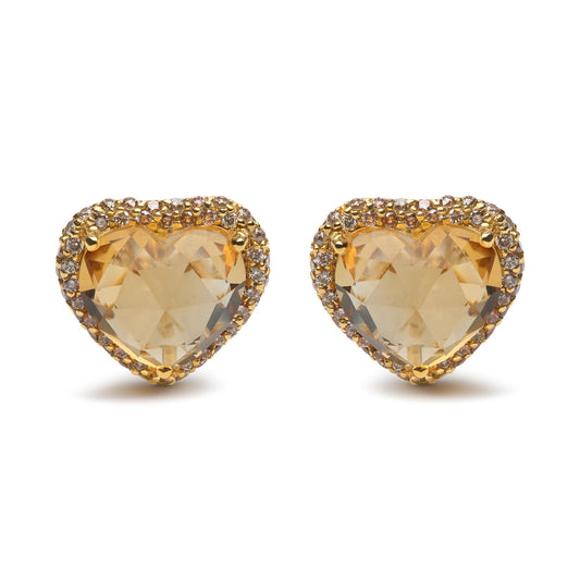 Front view of yellow metal heart-shaped earrings with yellow heart-shaped gemstones surrounded by small round brown gemstones in prong settings.