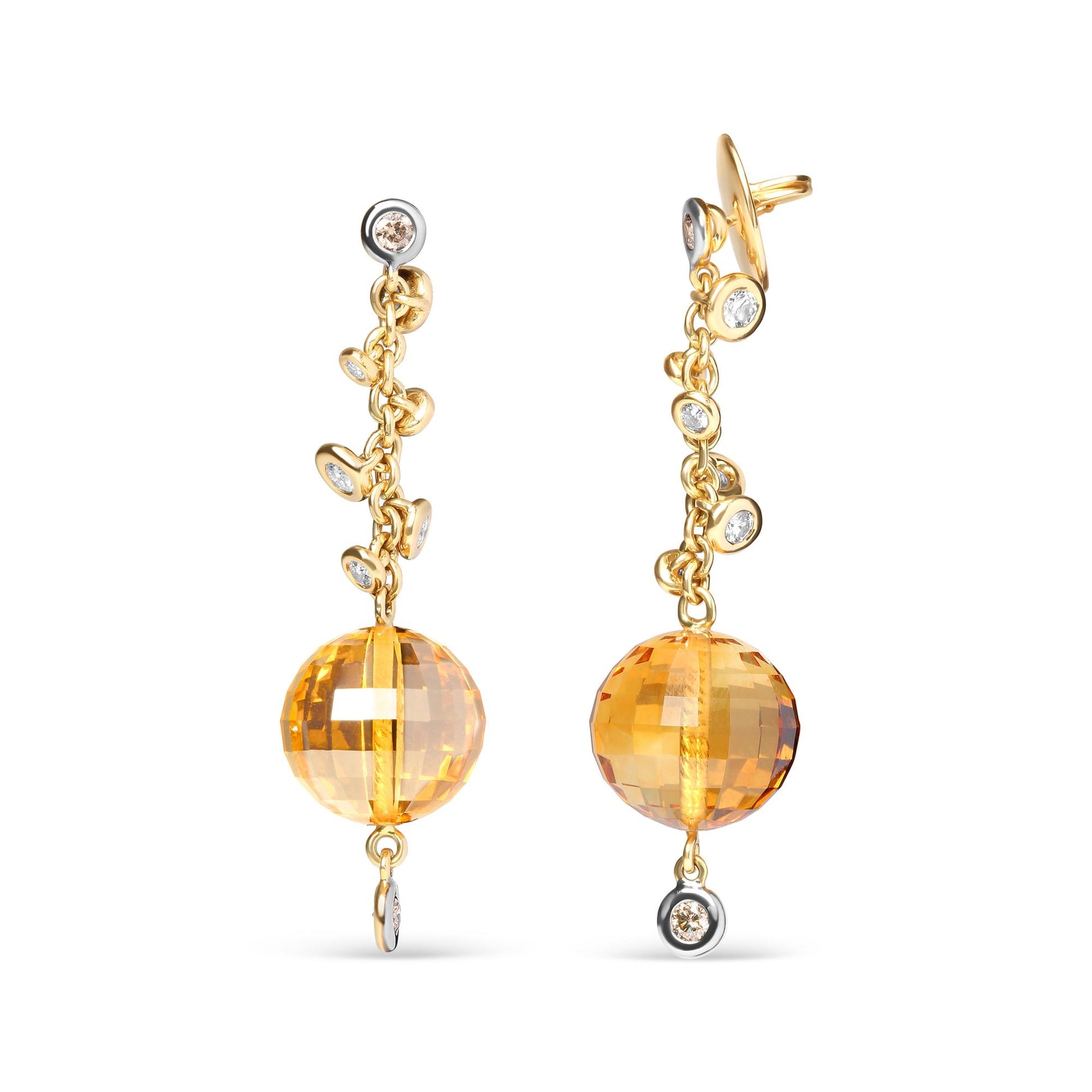 Front-facing view of a pair of yellow metal drop earrings featuring round bezel-set white and brown gemstones along the chain and a large faceted yellow gemstone with drilled setting at the bottom.