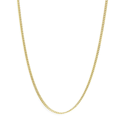 Close-up front view of a yellow metal chain necklace against a white background.