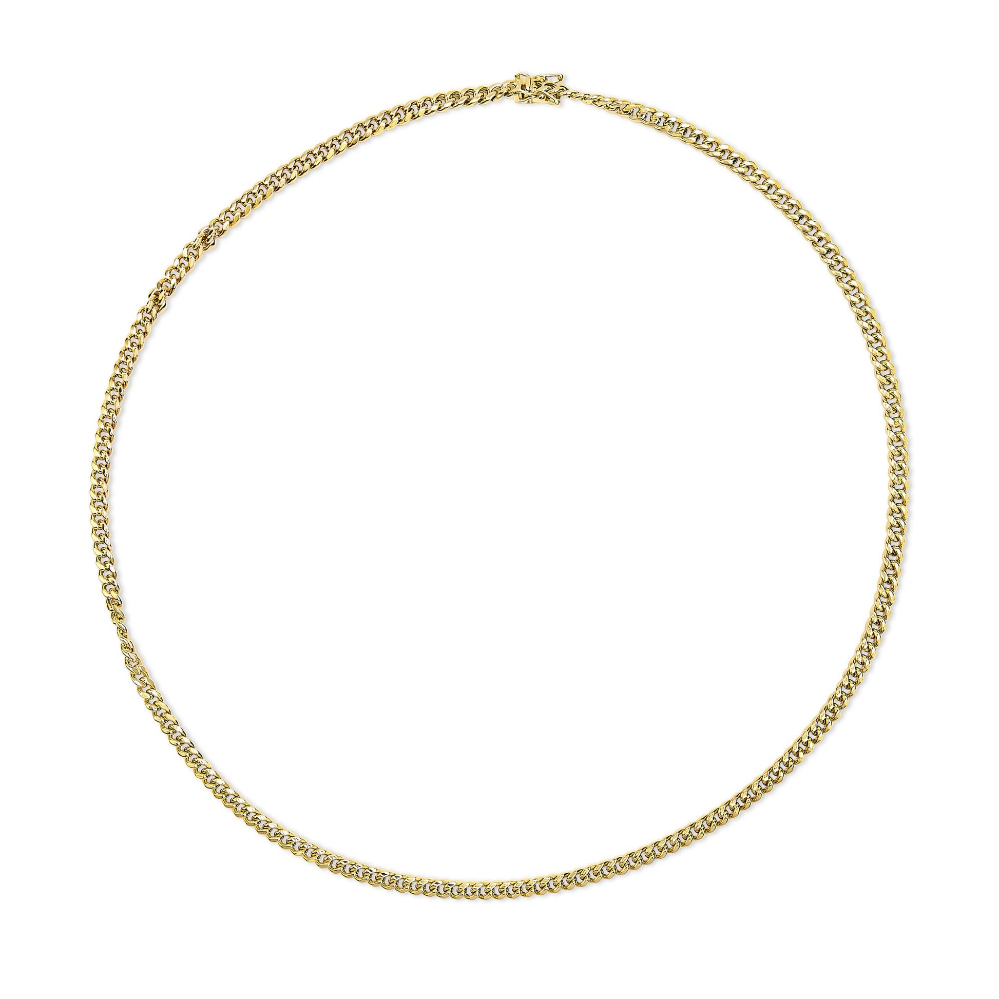 Top-down view of a yellow metal chain necklace laid flat in a circular shape against a white background.