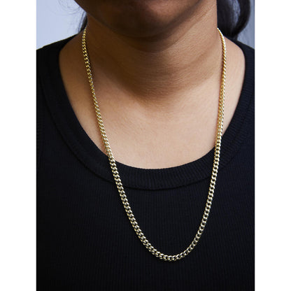 Yellow metal chain necklace shown worn on a model, front view focusing on the neckline.
