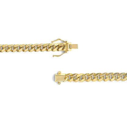 Close-up top view of a yellow metal chain with clasp opened, isolated on white background.