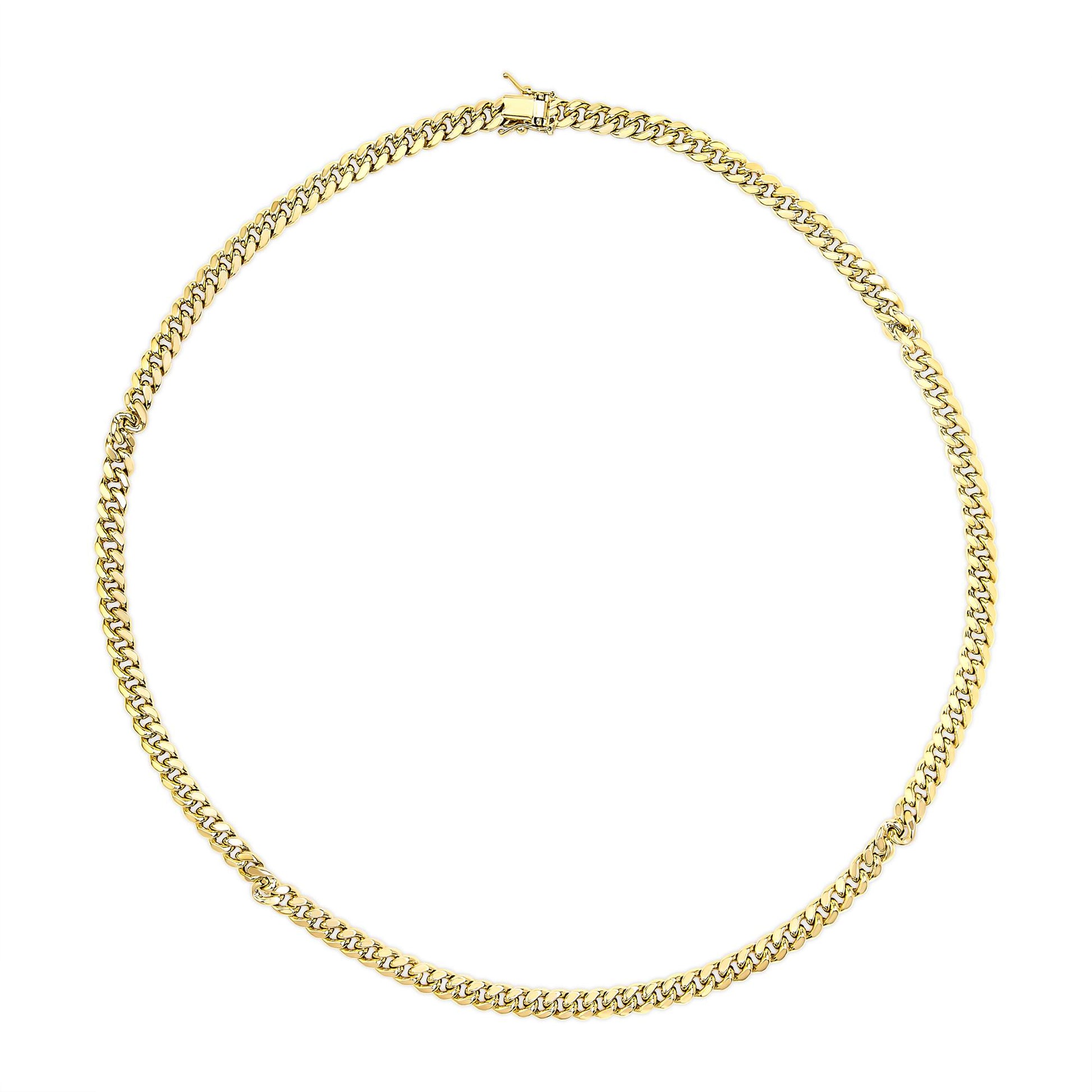 Top-down view of a yellow metal chain necklace with a box clasp on a white background.