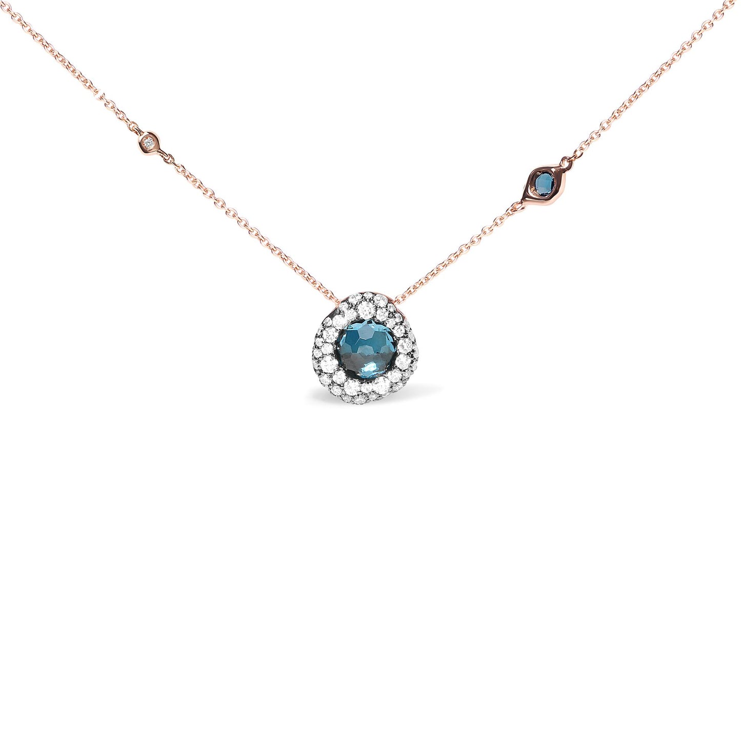 Rose metal necklace with a round blue gemstone pendant surrounded by white gemstones, and additional small white and blue gemstones spaced along the chain, shown from a front angle.