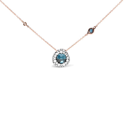 Rose metal necklace with a round blue gemstone pendant surrounded by white gemstones, and additional small white and blue gemstones spaced along the chain, shown from a front angle.