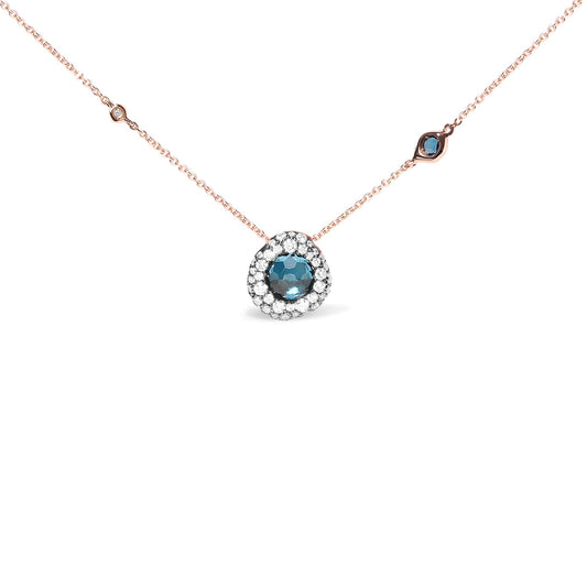 Rose metal necklace with a round blue gemstone pendant surrounded by white gemstones, and additional small white and blue gemstones spaced along the chain, shown from a front angle.