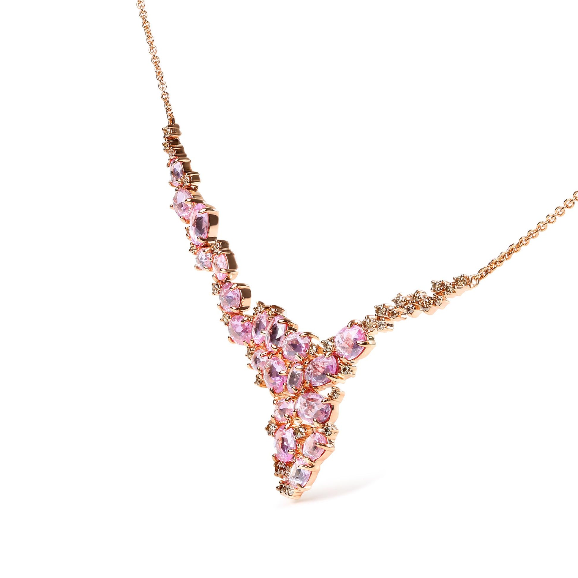 Close-up angle of a rose metal necklace featuring oval pink gemstones and round brown gemstones in prong settings.