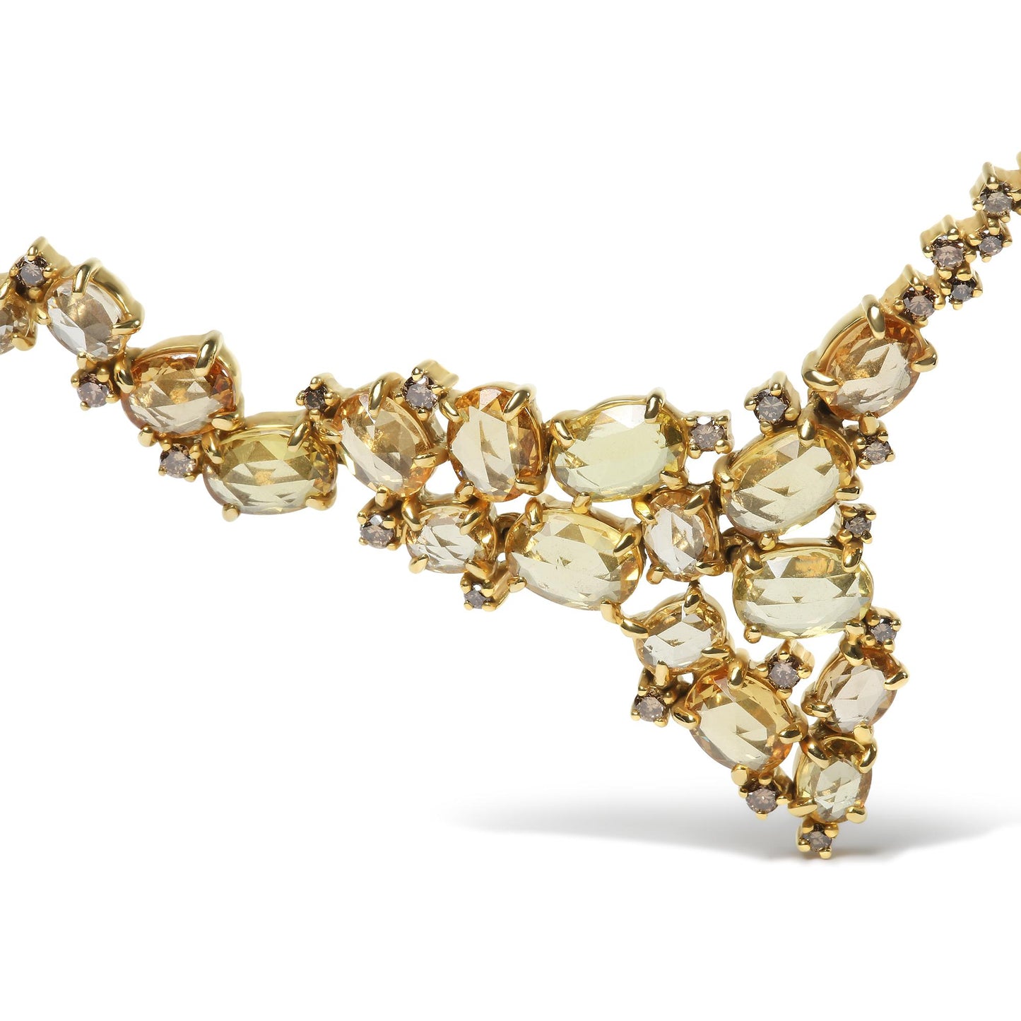 Close-up front angle of a yellow metal necklace featuring oval yellow gemstones and round brown gemstones in prong settings.