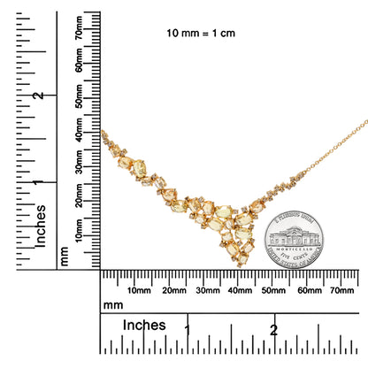 Yellow metal necklace with oval yellow gemstones and round brown gemstones in prong settings, displayed flat next to rulers and a coin for size reference, shown from a top-down angle.
