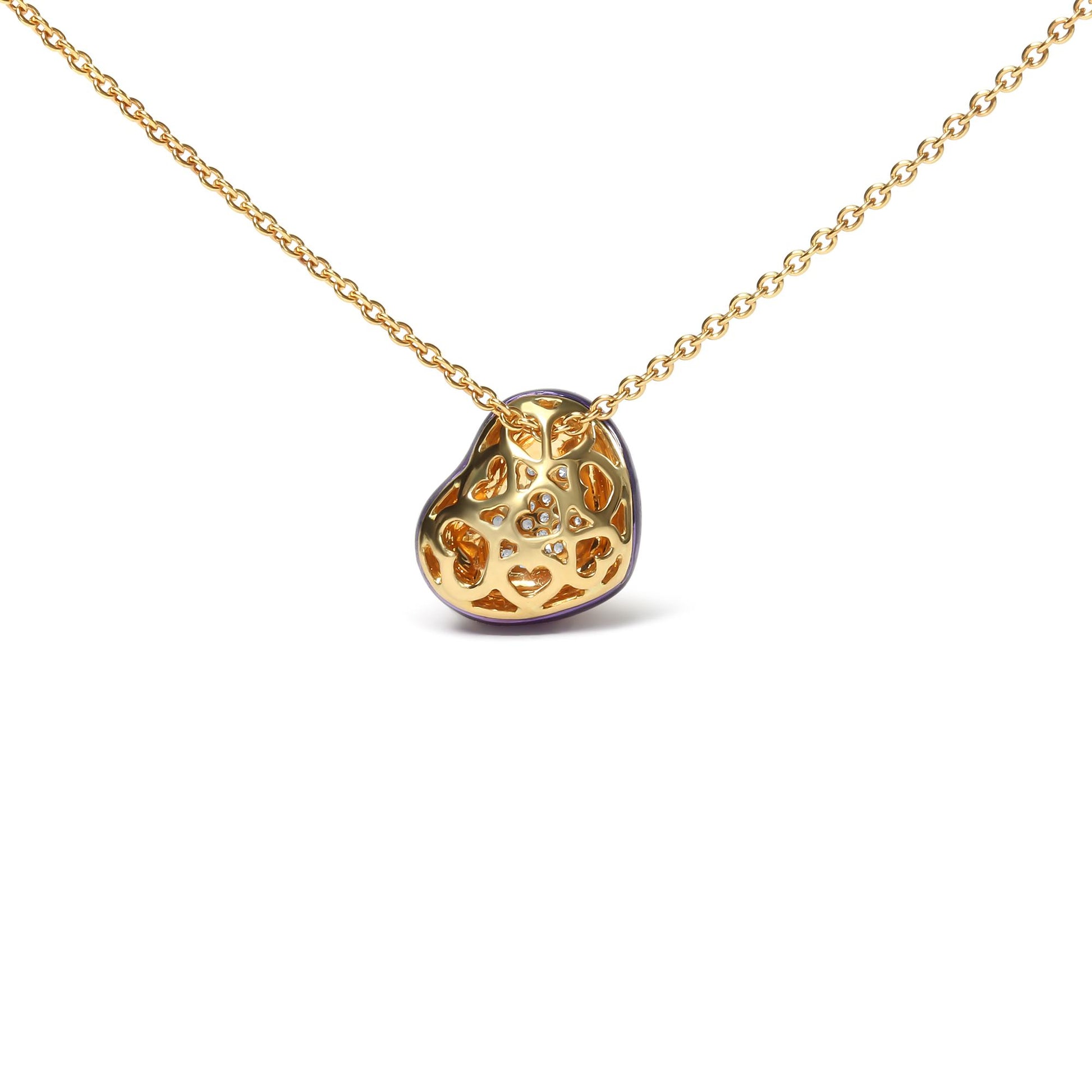 Front angle view of a yellow metal necklace with an abstract pendant featuring small round white gemstones in pave setting.