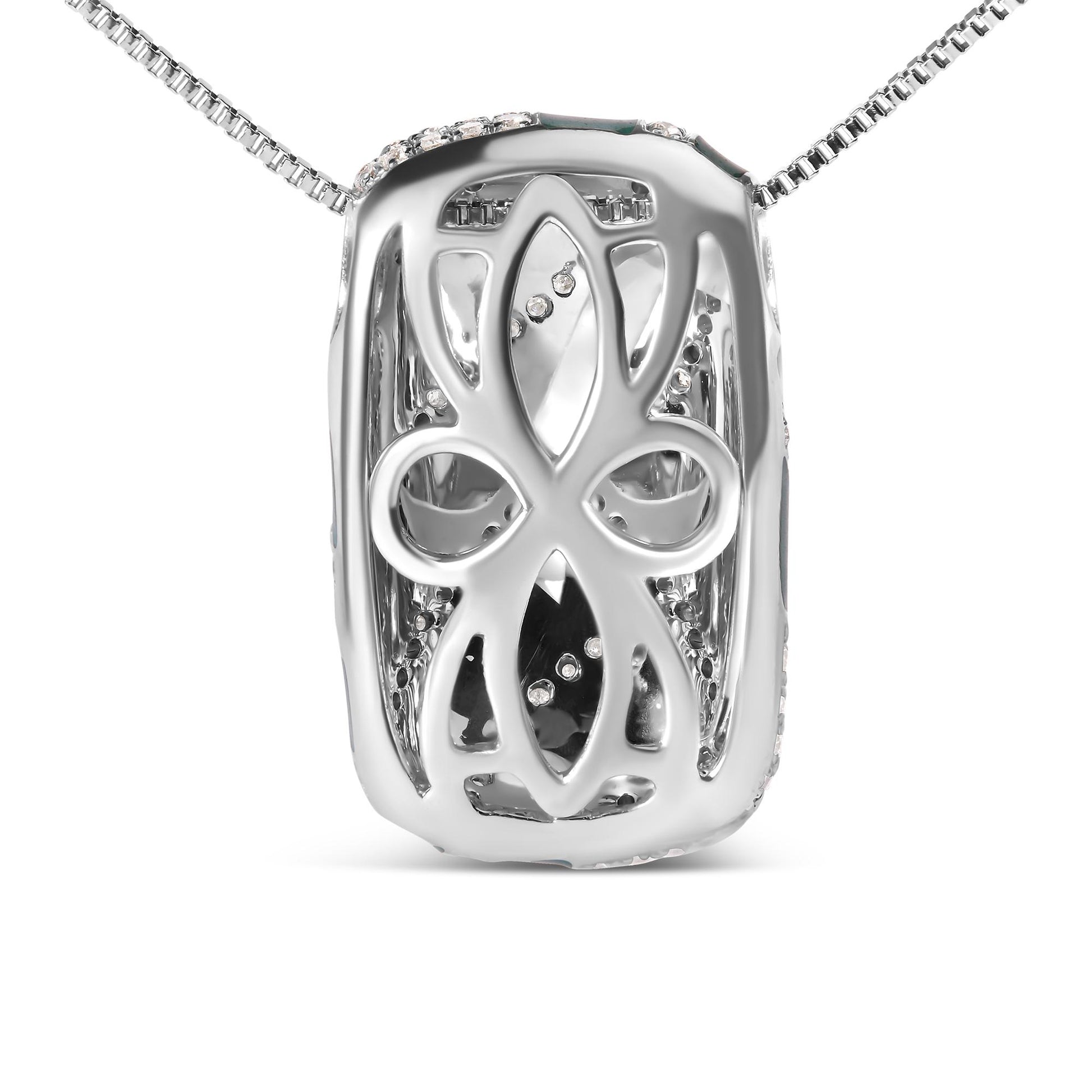 Close-up front view of a white metal necklace pendant with an intricate cut-out design and round white gemstones set inside.