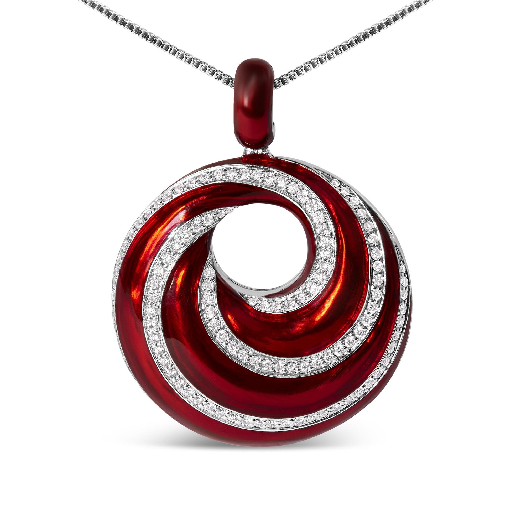 Close-up front view of a white metal necklace with a circular pendant featuring red enamel swirl design accented with rows of round white gemstones in prong settings.