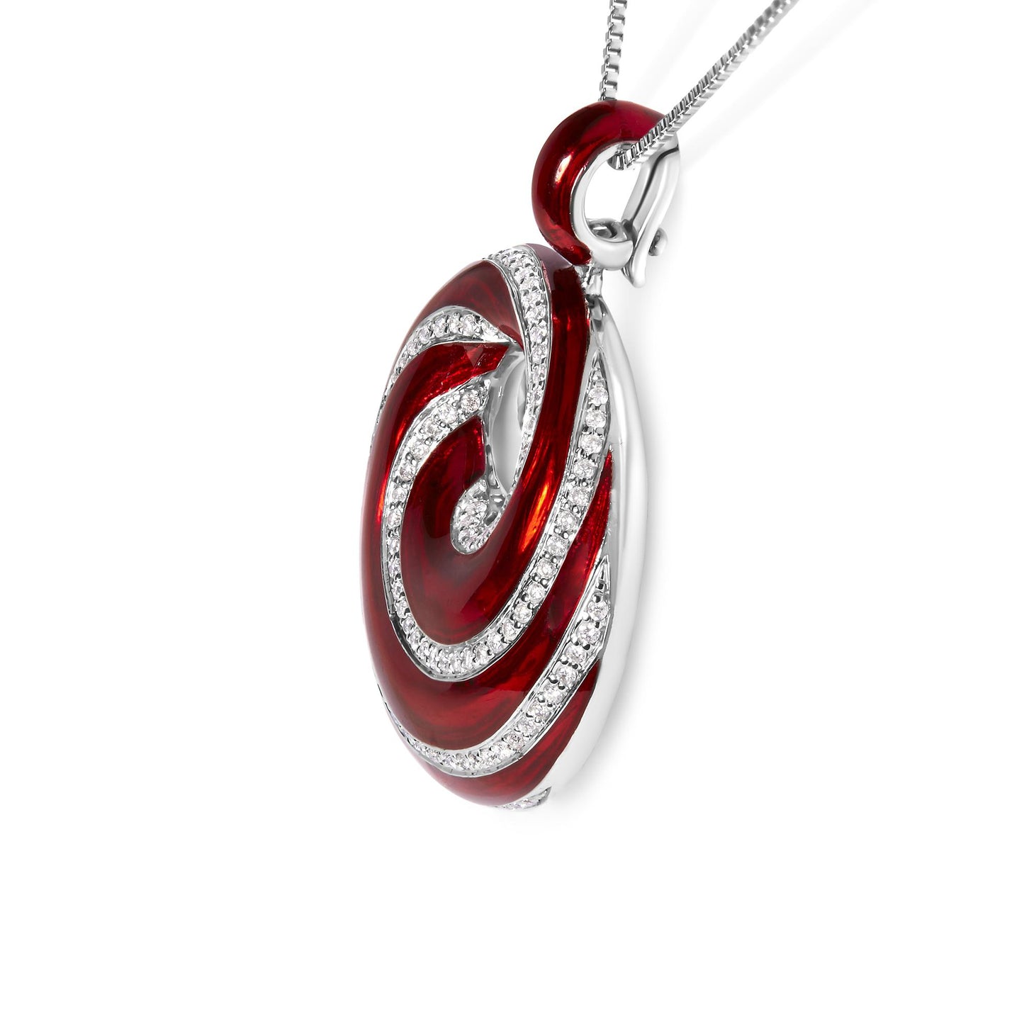 Close-up side angle of a white metal necklace pendant with red enamel and swirling rows of round white gemstones in prong settings.