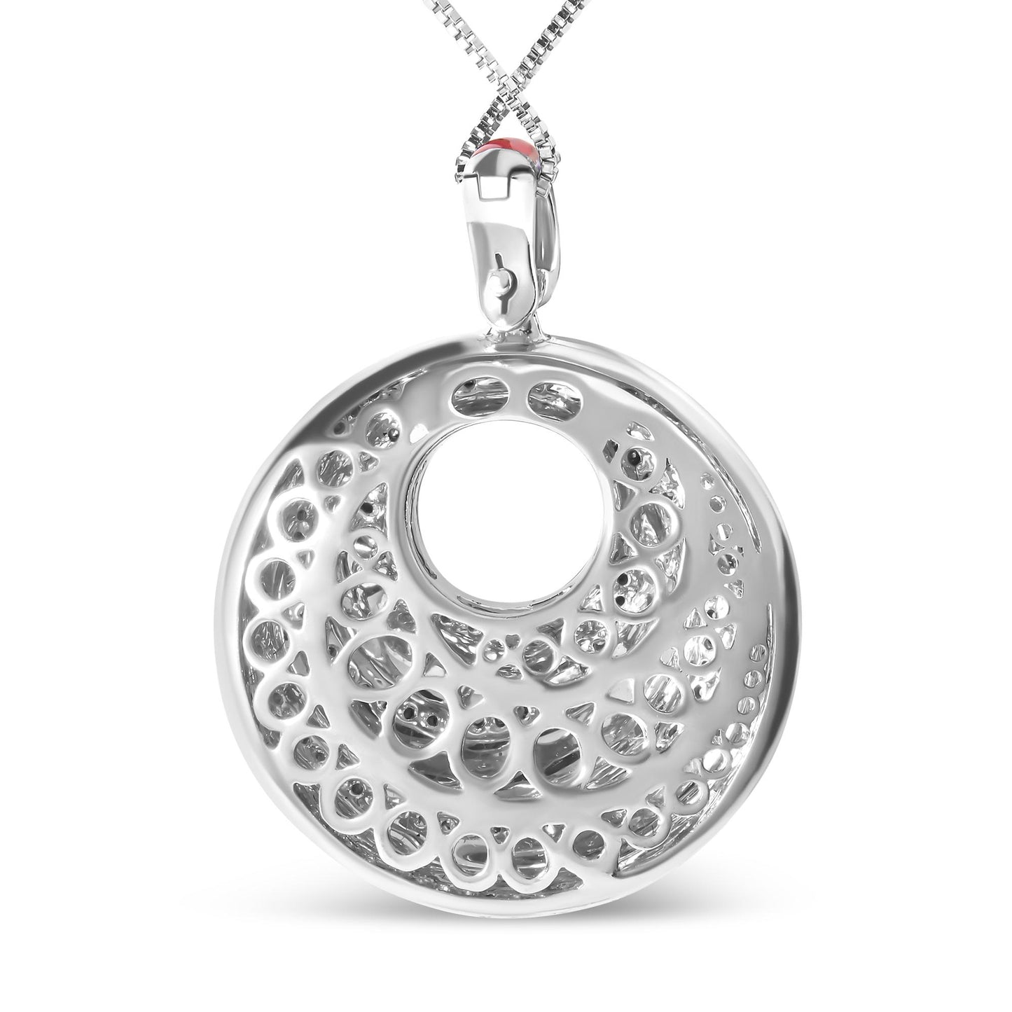 Close-up front view of a white metal circular necklace pendant with intricate openwork design and round white gemstones set in prongs, hanging from a white metal chain.