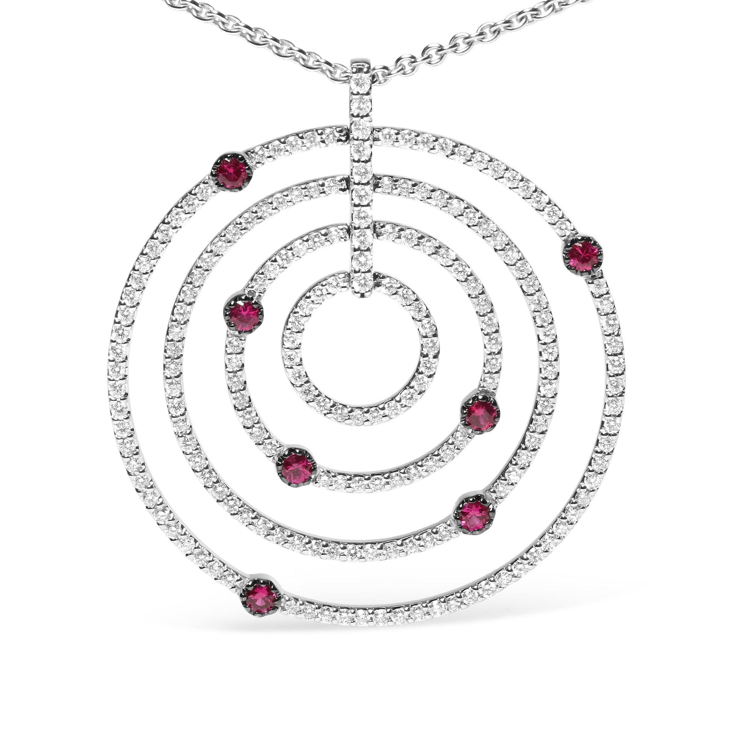 Front view of a white metal circular pendant necklace featuring multiple concentric circles adorned with small white gemstones and scattered red gemstones, shown against a white background.