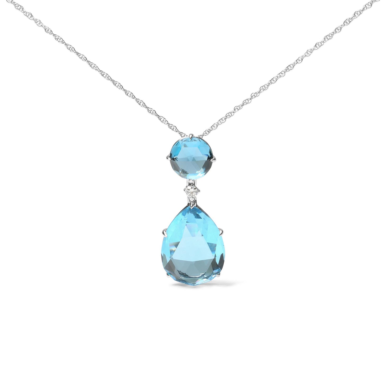 Front view of a white metal necklace with a pendant featuring a round blue gemstone above a small white gemstone and a larger pear-shaped blue gemstone.