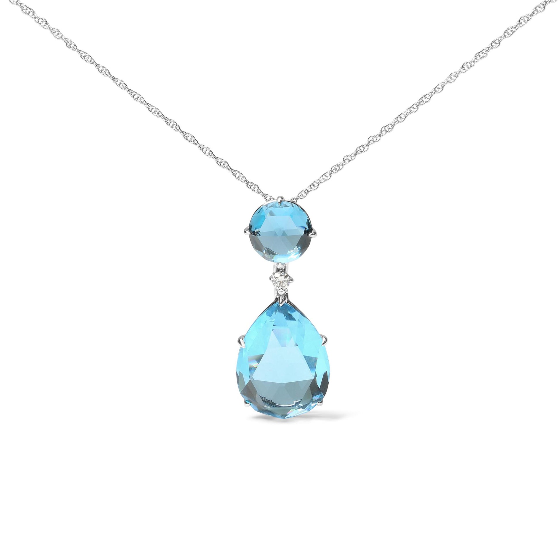 Front view of a white metal necklace with a pendant featuring a round blue gemstone above a small white gemstone and a larger pear-shaped blue gemstone.