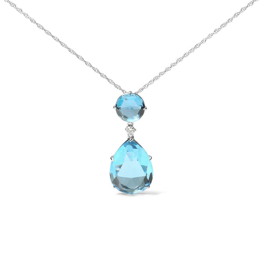 Front view of a white metal necklace with a pendant featuring a round blue gemstone above a small white gemstone and a larger pear-shaped blue gemstone.