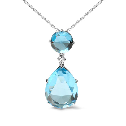 Front view of a white metal necklace with a round blue gemstone, a small white gemstone below it, and a pear-shaped blue gemstone hanging at the bottom.