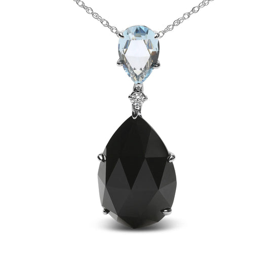 Front view of white metal necklace with a large pear-shaped black gemstone, smaller pear-shaped blue gemstone above it, and a round white gemstone between them.