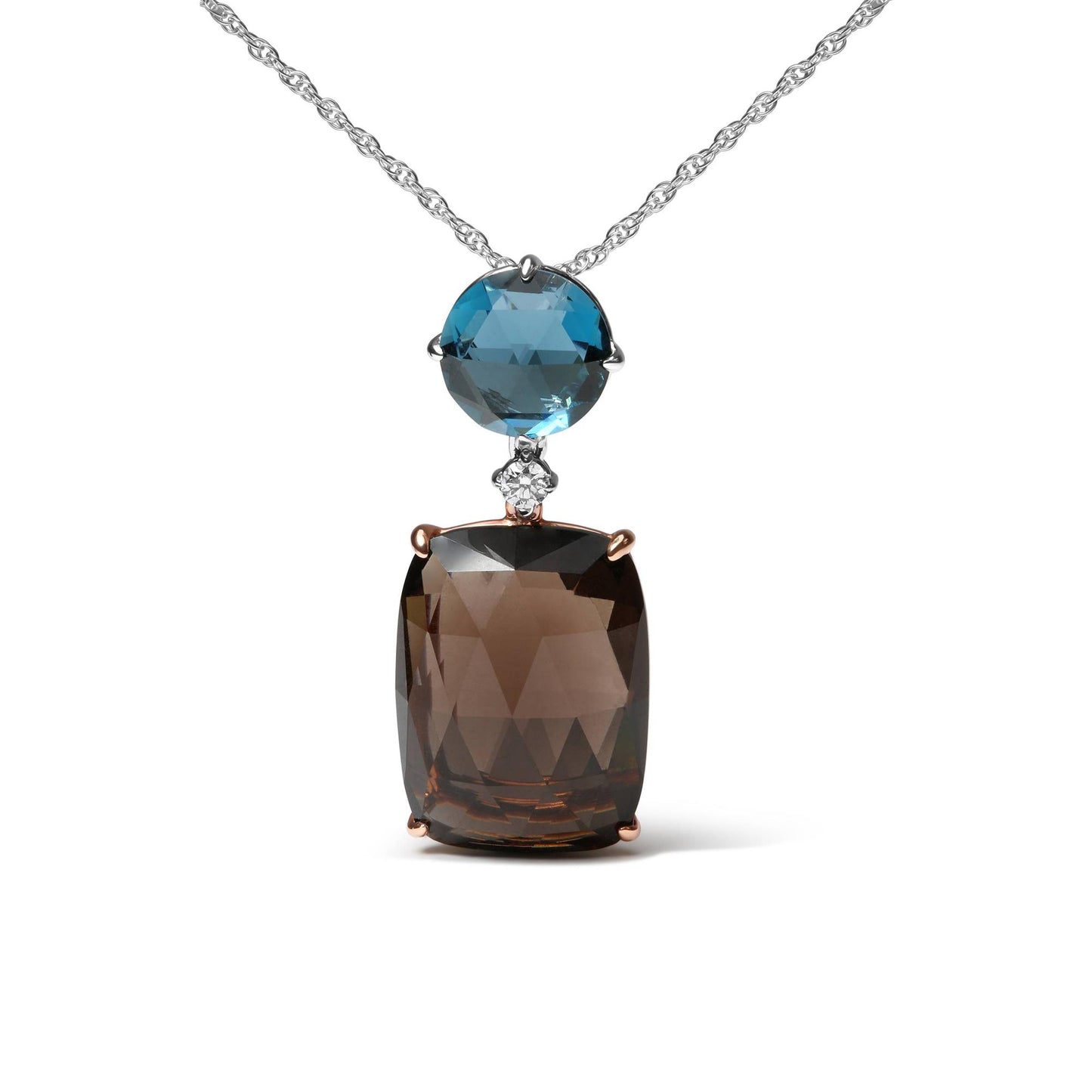 Close-up front view of a necklace with a white metal chain featuring a pendant with a large cushion-shaped smoky gemstone in rose-colored prong setting, topped by a small round white gemstone and a round blue gemstone set in white metal prongs.