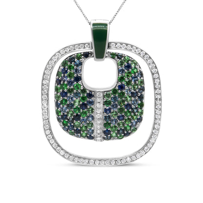 Front view of a white metal necklace pendant with an outer square frame set with white gemstones and an inner rounded square decorated with blue and green gemstones, and a green gemstone at the loop.
