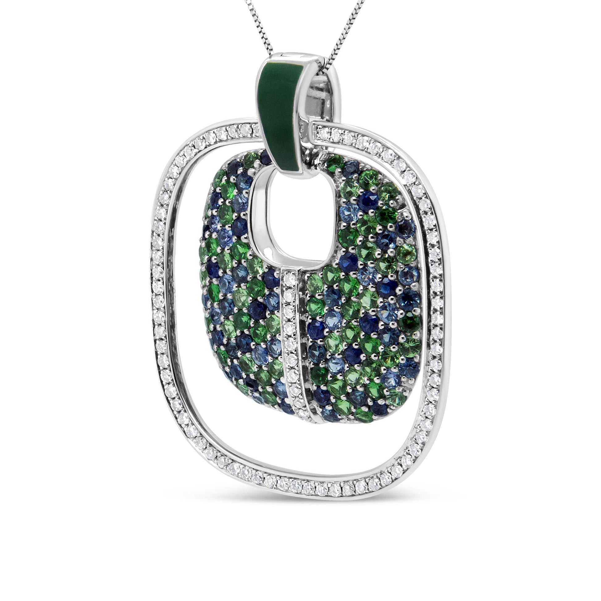 Close-up front angle of a white necklace pendant featuring an open square frame paved with white gemstones, with an inner curved square piece adorned with blue and green gemstones, and a small green enamel detail on the bail.