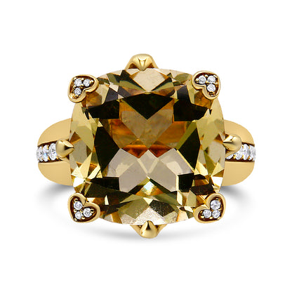 Front view of a yellow metal ring featuring a large cushion-shaped lemon-colored gemstone held by prongs with heart-shaped settings containing small white round gemstones, and additional small white round gemstones set along the band.