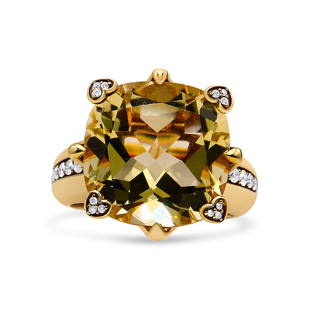 Front-facing shot of a yellow metal ring featuring a large cushion-shaped lemon-colored gemstone in the center, accented by small white round gemstones in heart-shaped settings at the four corners and along the band.