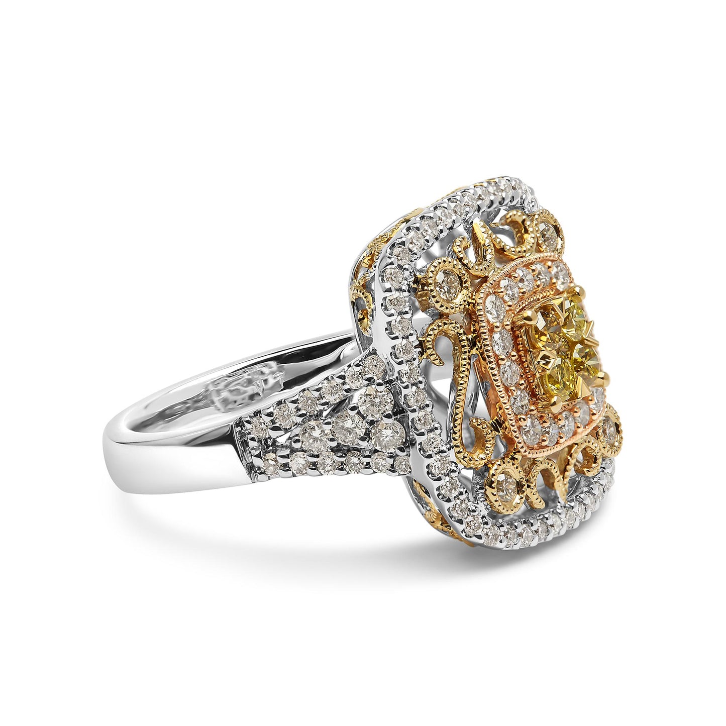 Close-up side angled view of a ring featuring an intricate design with white, yellow, and rose metal colors. The top is adorned with prong-set round white gemstones around the edges and center, with a cluster of prong-set round yellow gemstones in the middle, surrounded by ornate scrollwork. The band also has prong-set round white gemstones.